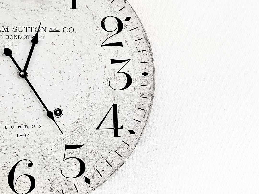 Photo by Alex Lion white analog wall clock at 10 00